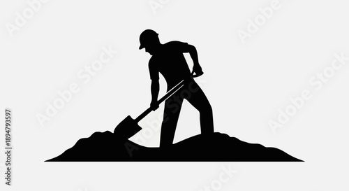 Silhouette of a construction worker digging with a shovel.
