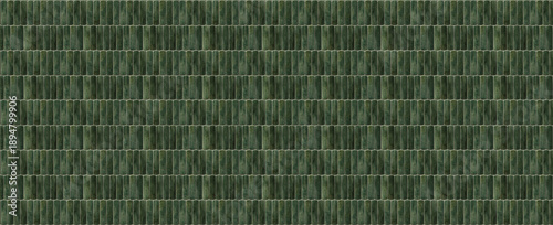 Dark green ceramic finger tiles texture background with vertical pill shaped mosaic pattern for interior wall design and architectural surfaces © MonTeArt