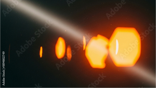 Blurry orange lights illuminating a dark environment from a diagonal viewpoint