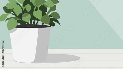 A green plant in a white pot sits on a wooden table