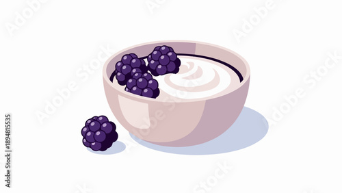 A light pink bowl filled with creamy white yogurt topped with dark purple blackberries