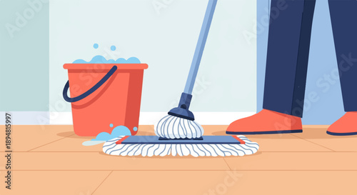 A person is mopping a wooden floor with a bucket of soapy water nearby