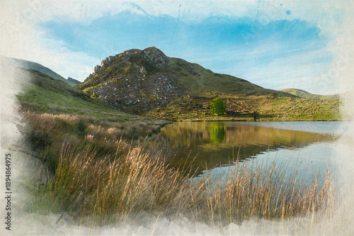 Digital watercolour painting of Llyn y Dywarchen and Clogwyngarreg as the sun sets in the Eryri National Park, Wales, UK