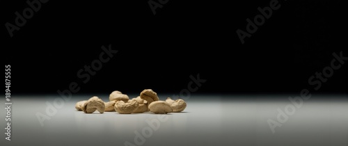 Isolated Cashew nuts on a white background featuring a pattern, health, and fruit themes