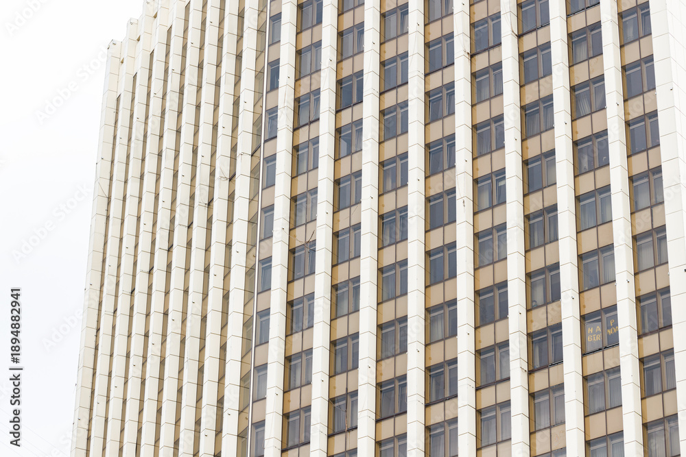 Fototapeta premium business facade concrete facade huge external side building high rise skyscraper Eastern Europe aesthetic background perspective point