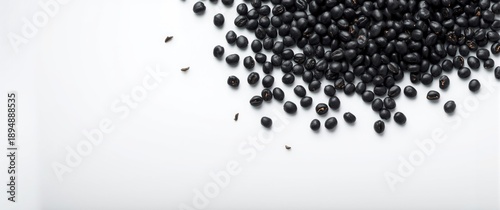 Food and vegetable theme with black beans on a white background, emphasizing natural and healthy eating