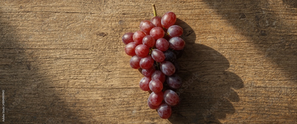 Obraz premium Old Wooden Background with Red Grapes