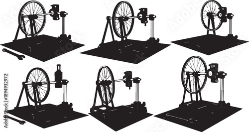 Six different black silhouette machine designs with wheels shown