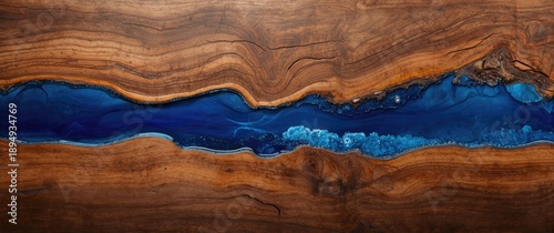 Panel kuchenny z motywem Epoxy resin art in blue, top view with wooden nature backdrop