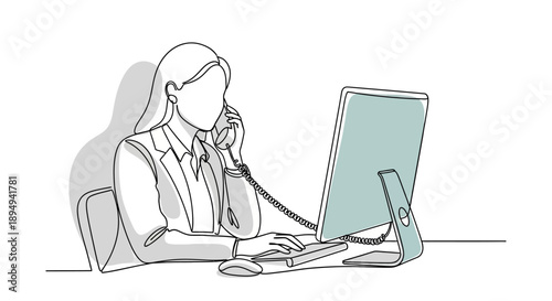 Woman Working on Computer and Talking on Phone.