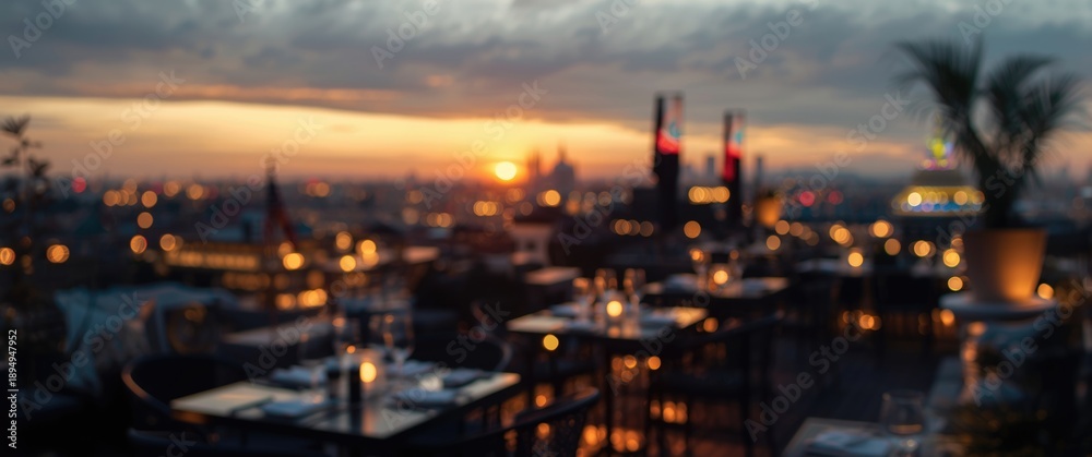 Fototapeta premium Hotel balcony rooftop celebration overlooking cityscape at sunset happy hour with blurred bar or restaurant dining table and romantic golden light