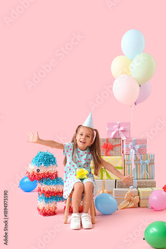 Cute little girl sitting on...