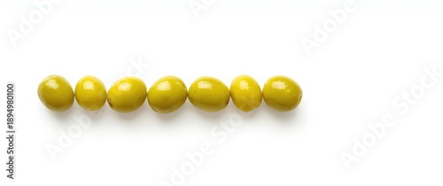 Multiple green olives arran...