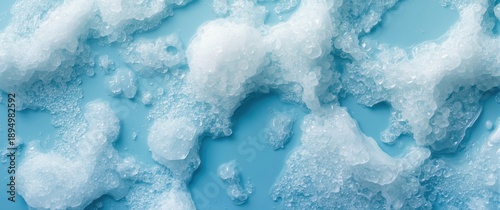Foam bubble collection on a blue background viewed from above for beauty and health care concept design