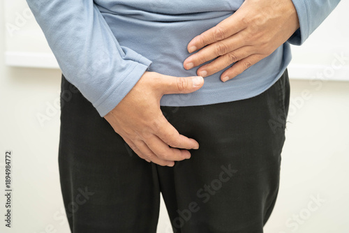 Tableau sur toile Hernia, Asian man stomach ache, abdominal pain and urology problem health