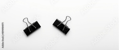 Two Black Binder Clips Disp...