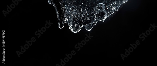 Water droplets against a black background