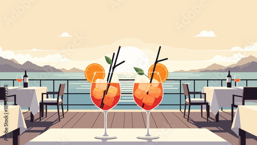 Two refreshing aperol spritz cocktails on a terrace overlooking the sea at sunset