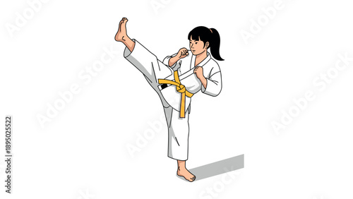 Martial arts girl demonstrates high kick in karate uniform with yellow belt