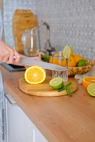 Preparing Citrus Infused Water in Kitchen