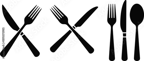 Black silhouettes of forks and knives and spoons on white background