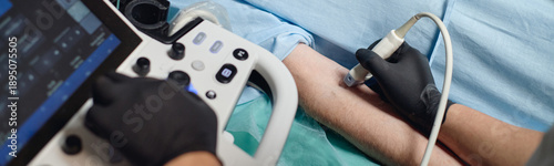 Photos Website header shot of Caucasian adult arm undergoing vascular ultrasound examin