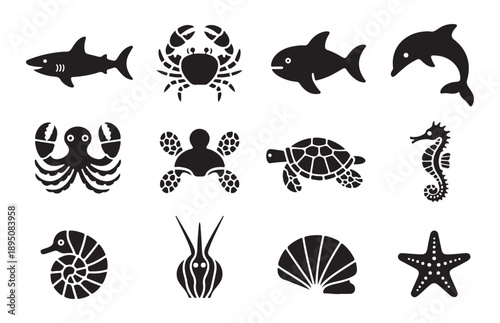 Marine animals vector silhouette icon set featuring a shark crab fish dolphin octopus and other sea creatures