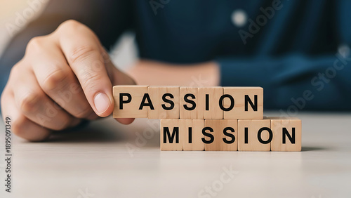 Arranging wooden blocks to form the words 'passion' and 'mission'
