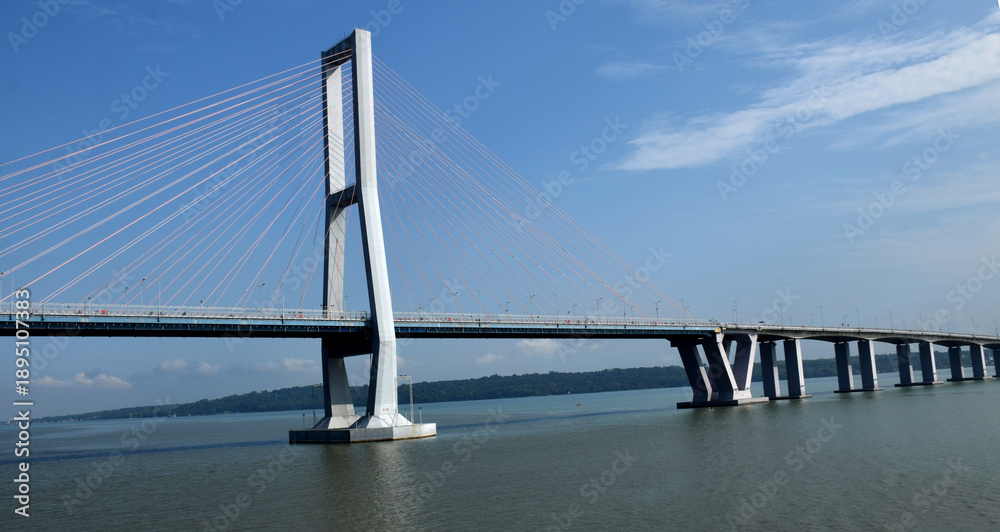 Fototapeta premium The architecture of the Suramadu Bridge, which spans the Madura Strait, Indonesia, was photographed from a ship about to pass beneath it.