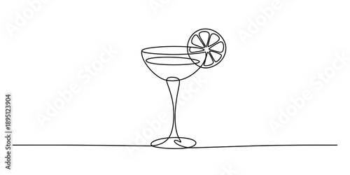 Continuous line drawing of a coupe cocktail glass with a lemon slice garnish Vector, illustration