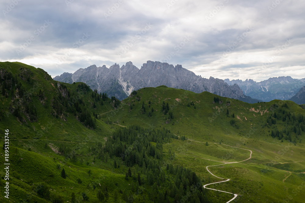 Obraz premium Panoramic view of alpine peaks during the summer season. Unspoiled nature.