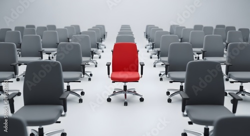 Single red office chair stands out among standard gray chairs