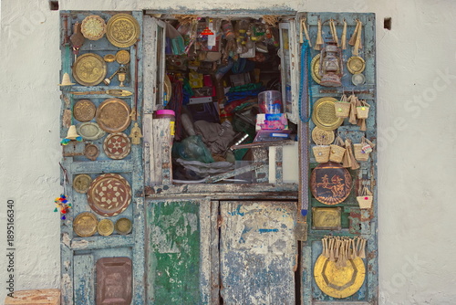 Fotografija Dilapidated, hole- in-the-wall, little old shop in the medina crammed with near useless items, selling a hodgepodge of things