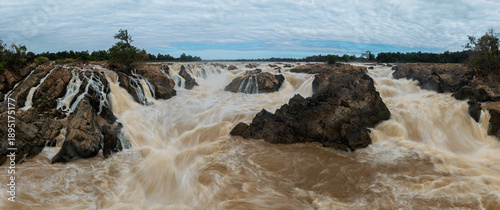 Panoramic view of turbulent cascades and rocky islands at Khone Phapheng Waterfall.