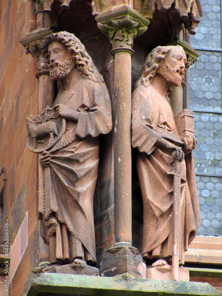 Obraz premium Zoomed detailed view of Gothic statues on the west portal of Freiburg Minster, Germany, part of a medieval sculptural program depicting biblical scenes as a visual Bible for the illiterate, Feb. 2011