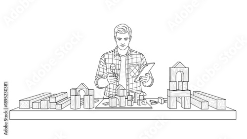 Architect designing with blocks and tablet at desk