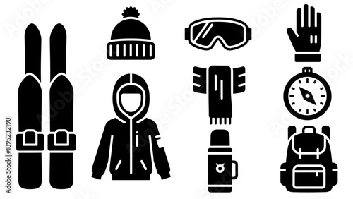Winter gear set with ski equipment and adventure essentials in silhouette design