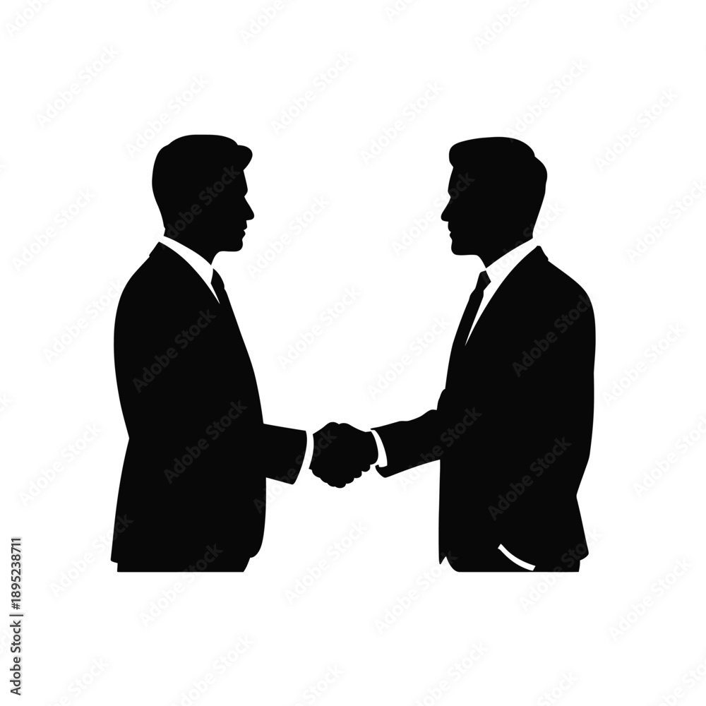 Fototapeta premium Two men in suits shaking hands silhouette handshake