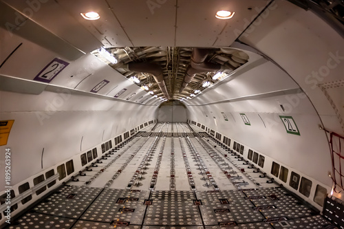 Midnight Freight: Cargo Jet Poised for Departure on Rain-Soaked Runway