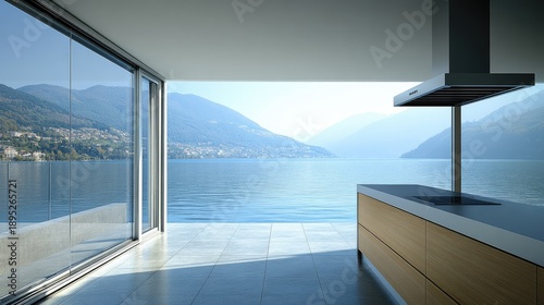 Bright Modern Kitchen with Panoramic Lake and Mountain Vista Through Expansive Glass Doors