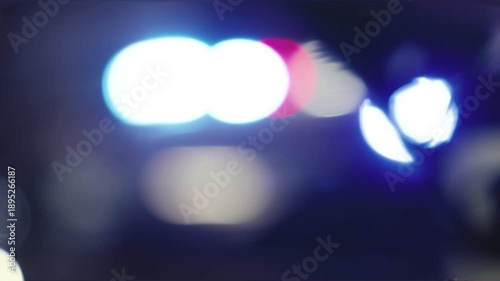 Out of focus red and blue police lights, symbolic of emergency and law enforcement