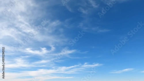 Clear Blue Sky with White Clouds.