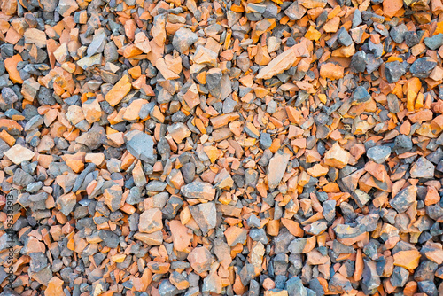 scattered rough fragments of broken brick and stone aggregate