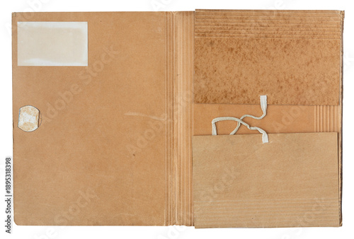 Open vintage brown cardboard folder with paper pockets and string tie closure, top view isolated on white