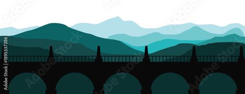 Stunning mountain landscape with historic bridge in silhouette