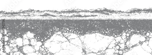 Abstract textured gray and white cracked surface with granular and circular patterns