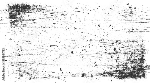 Grungy black and white textured background with scratches and speckles grunge