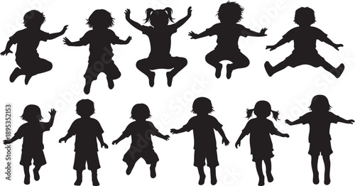 Silhouettes of happy children jumping and playing together outdoors