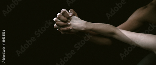 Photography This dynamic image showcases the intertwining of hands in a captivating moment that reflects connection, emotion, and artistry, set against a rich, dark backdrop with contrasting tones