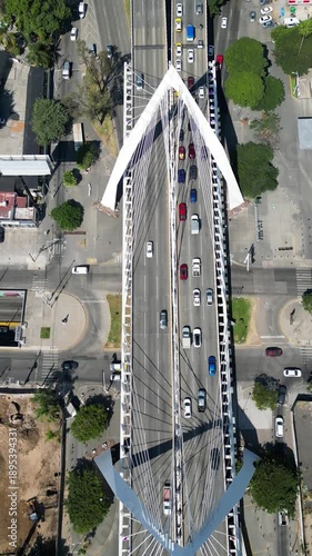 Aerial view of Matute Remus Bridge and a busy avenue in Guadalajara. Modern city infrastructure with cars and traffic on a sunny day
